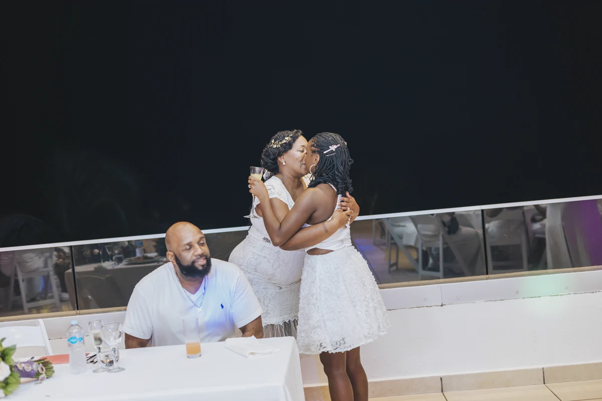 Family sharing a joyful moment during a Punta Cana wedding reception
