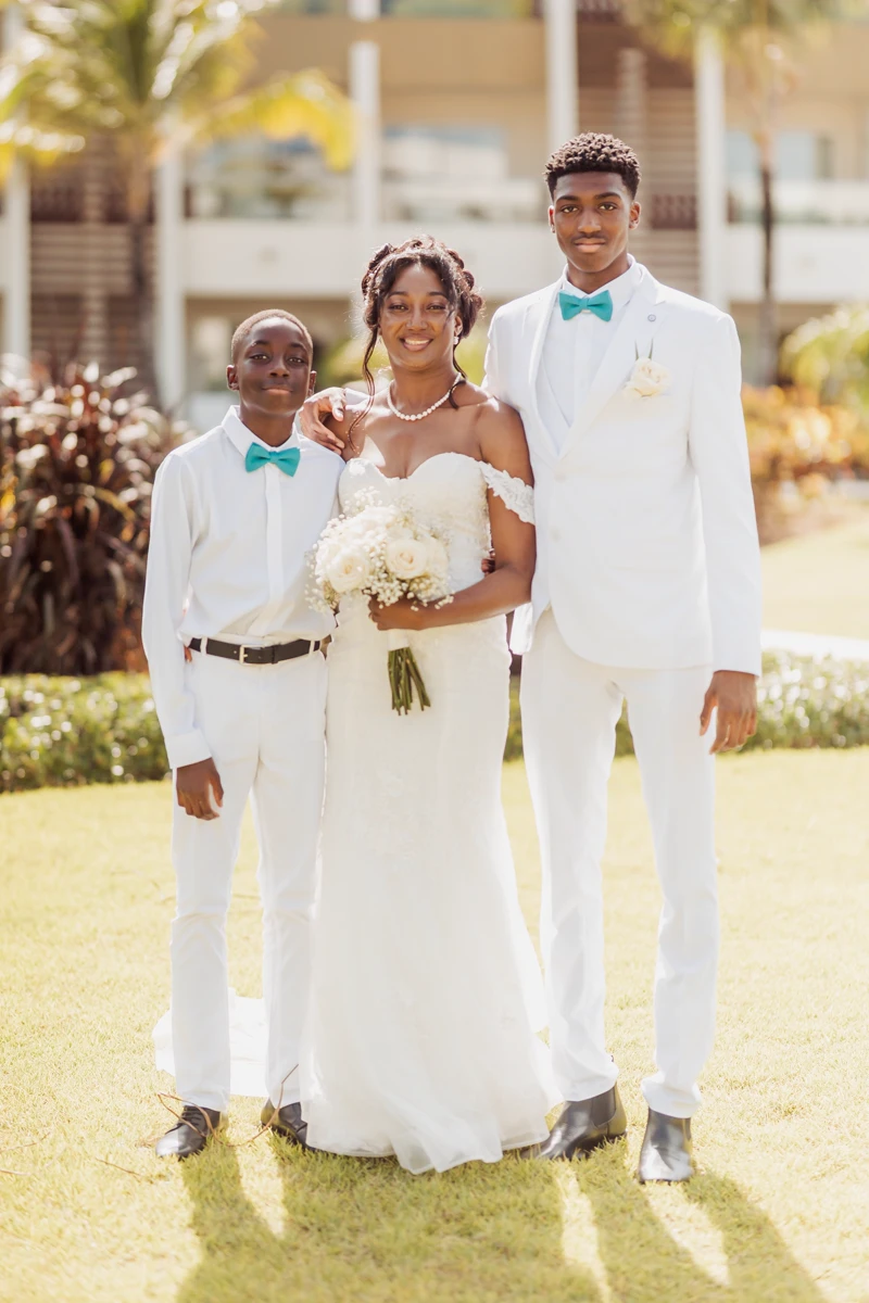 Bride posing with her children after a Punta Cana wedding