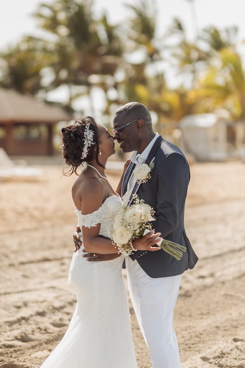Newlyweds embracing on a quiet Punta Cana beach
